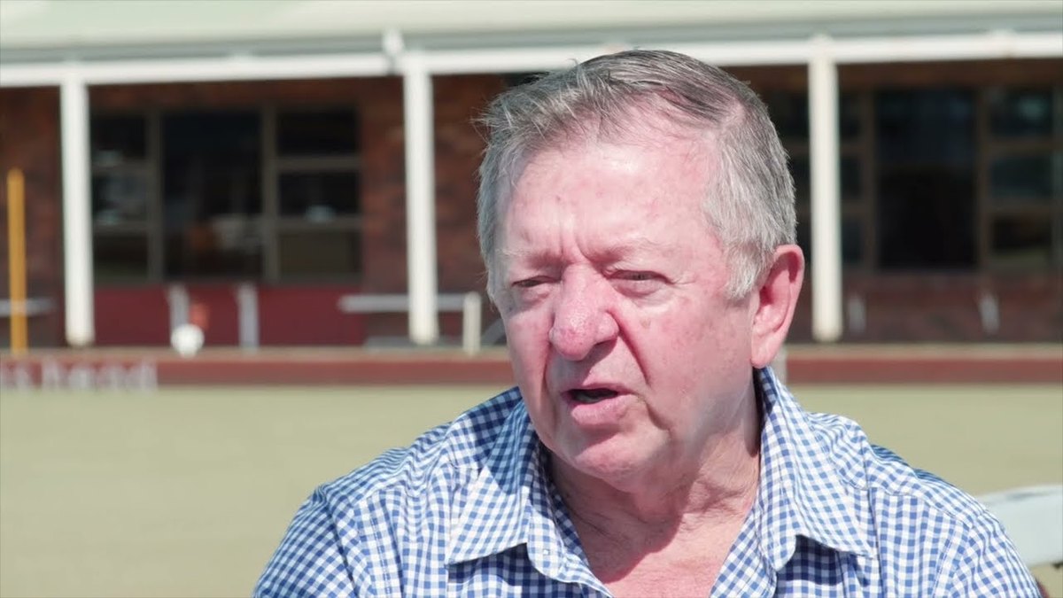 Roger Hong, CEO of Evans Head Bowling Club, speaking beside the greens
